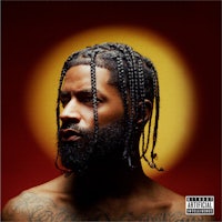 a man with dreadlocks in front of a red background